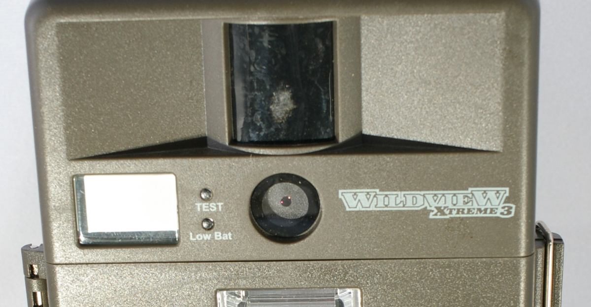 A camera trap, for taking pictures of game on trails. This model is for hunting.
Motion detector on top, lens in the middle, flash on the bottom, with a little LCD for showing how many pictures taken/left on the left.