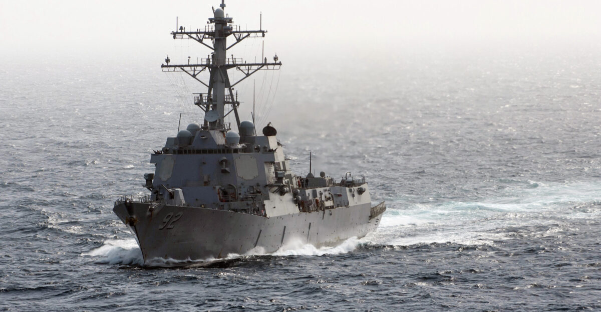 ARABIAN SEA Feb 13 2012 The Arleigh Burke-class guided-missile destroyer USS Momsen DDG 92 arrives alongside the Nimitz-class aircraft carrier USS Carl Vinson CVN 70 not pictured Carl Vinson and Carrier Air Wing CVW 17 are deployed to the U S 5th Fleet area of responsibility U S Navy photo by Mass Communication Specialist 2nd Class James R Evans Released 120213-N-DR144-128