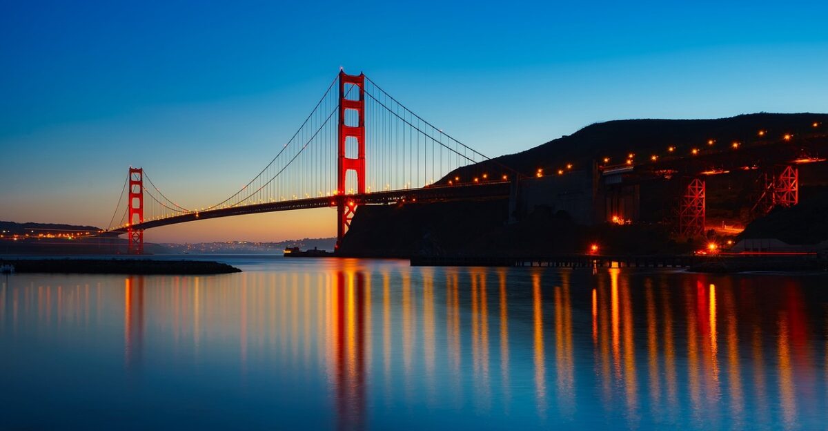 panorama golden gate bridge san francisco bay suspensio bridge infrastructure bridge famous places of interest nature illuminated reflection water reflection landmark architecture sunset dusk lights glow san francisco california water