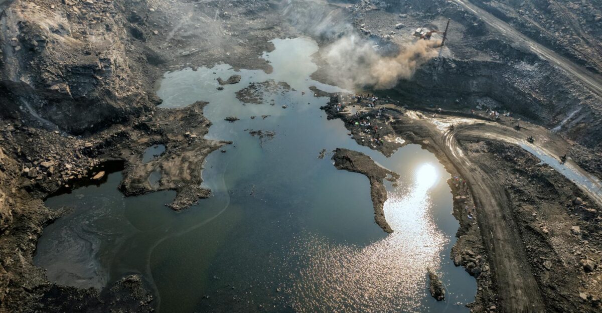Breathtaking aerial view of a coal mine with water reflection in Dhanbad India