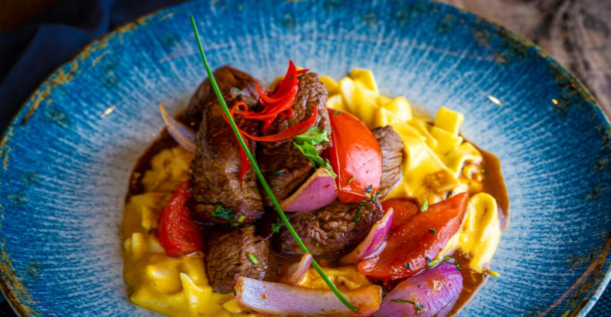 Mouthwatering beef stroganoff served with pasta and fresh vegetables