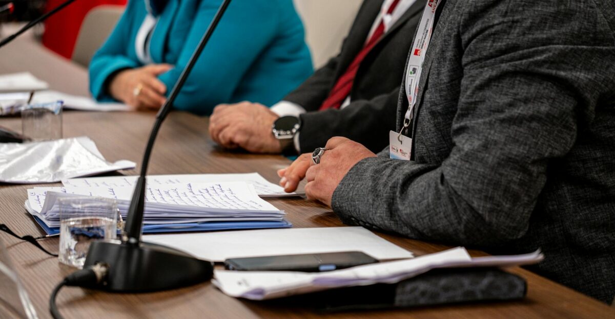 Close-up of professionals discussing documents at a business meeting in Ankara Turkey