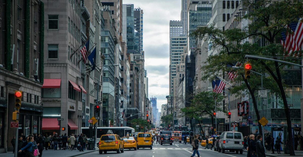 Vibrant street view of New York City with pedestrians yellow cabs and skyscrapers