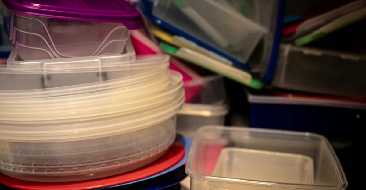 A variety of plastic storage containers stacked together ideal for organizing kitchen spaces