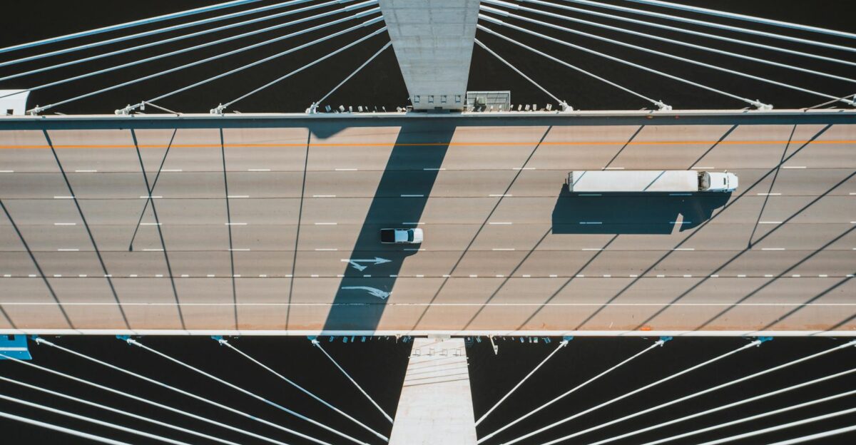 Aerial shot of a modern suspension bridge in Louisville with vehicles in motion