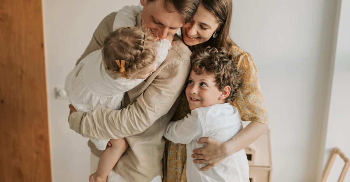 A heartwarming scene of a family hugging indoors showcasing love and togetherness