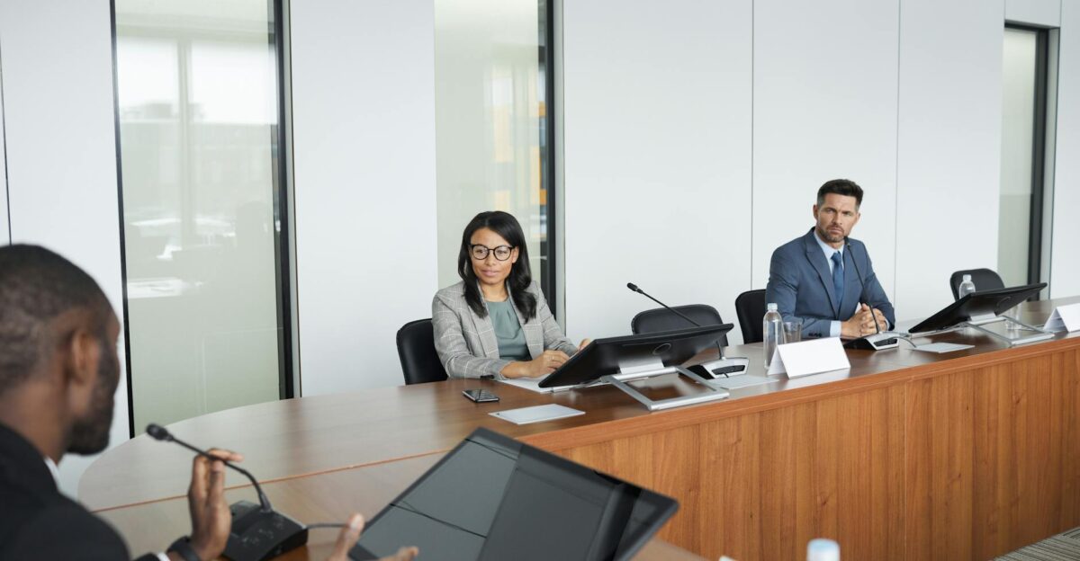 Professionals engaging in a meeting in a bright modern conference room showcasing diversity and collaboration