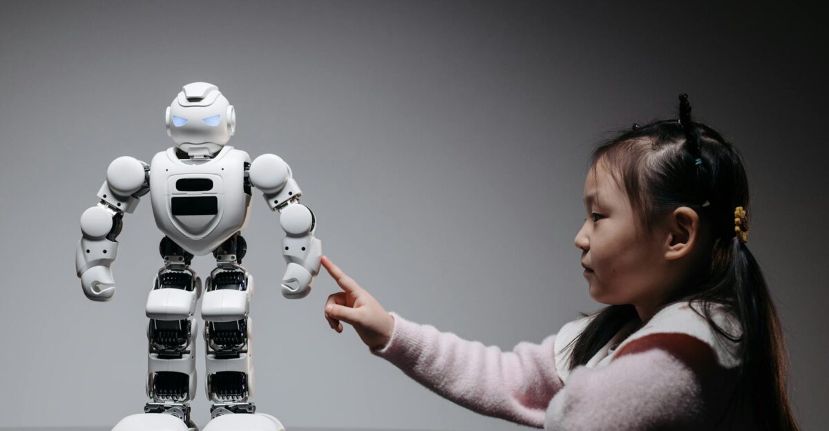 A young girl engaging with a robotic toy highlighting curiosity and innovation