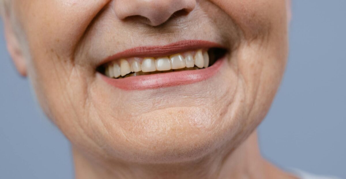 A detailed close-up of a senior woman s smile showcasing her natural teeth and wrinkles