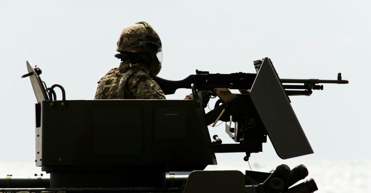 man in battle tank