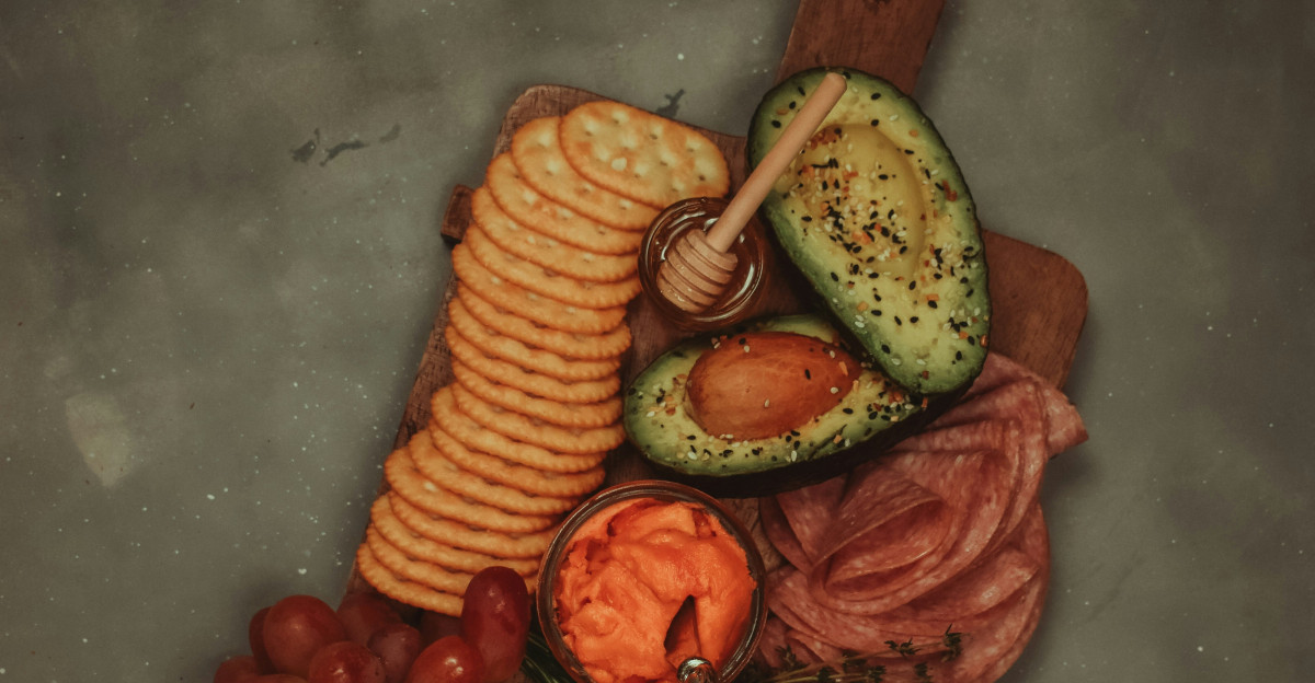 sliced banana and red apple fruits on blue surface