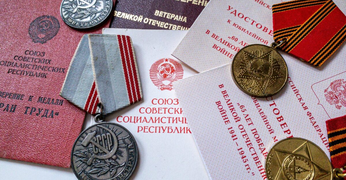 silver round coin on white printer paper