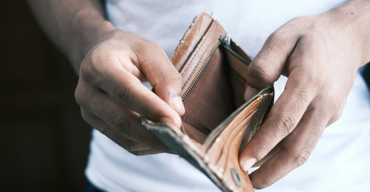 person holding brown leather bifold wallet