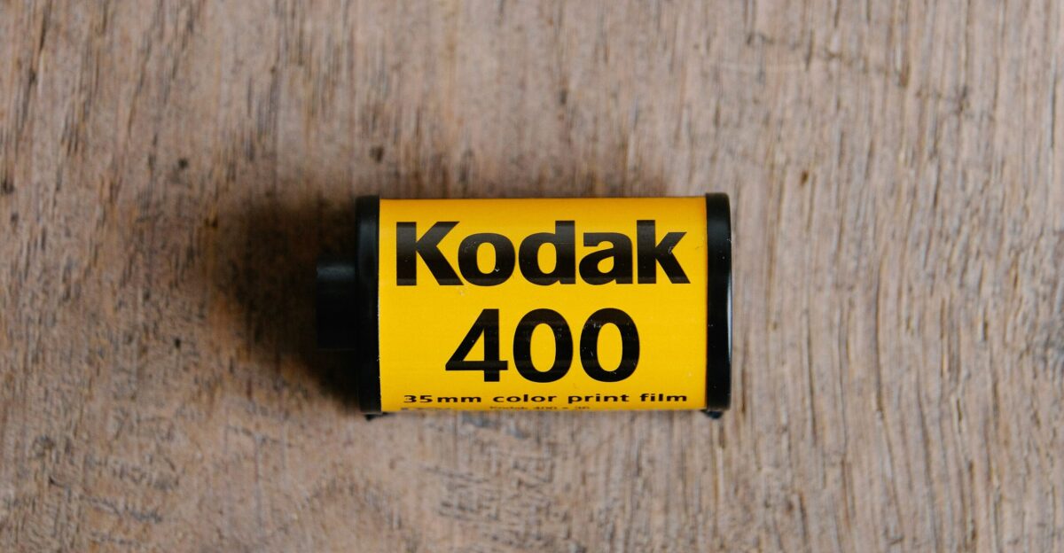 a close up of a battery on a wooden surface