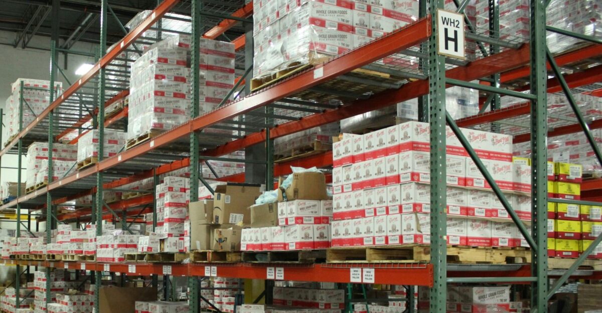 white and red cardboard boxes on shelf