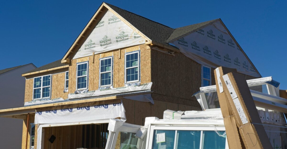 a house under construction with the roof ripped off