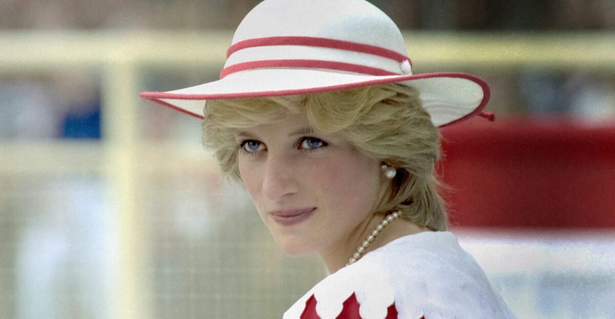 a woman in a red and white dress and hat