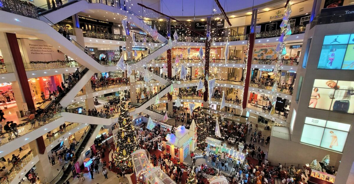 a mall filled with lots of people walking around