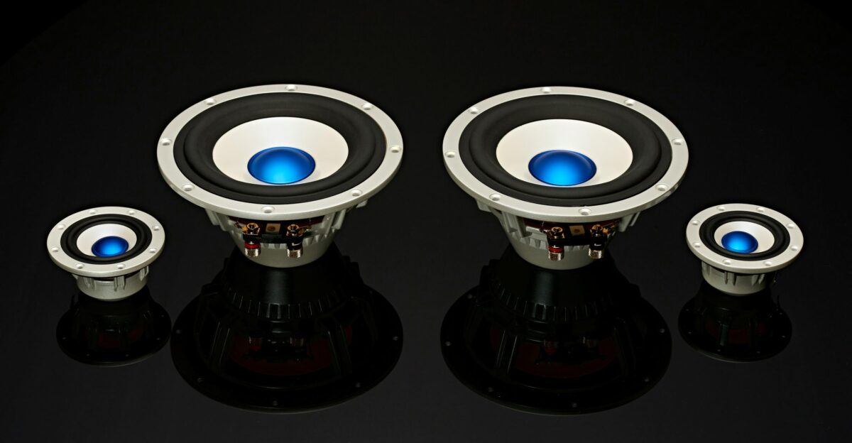 a pair of speakers sitting on top of a table