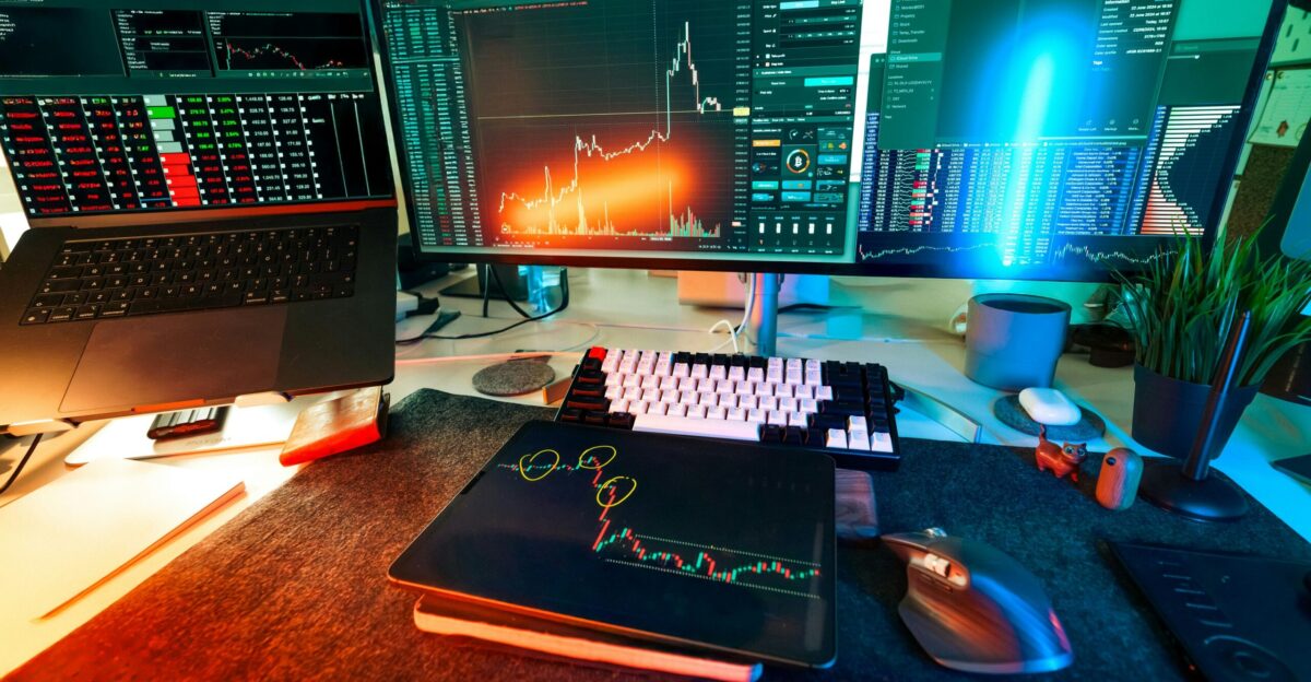 A trader s desk is lit up with charts