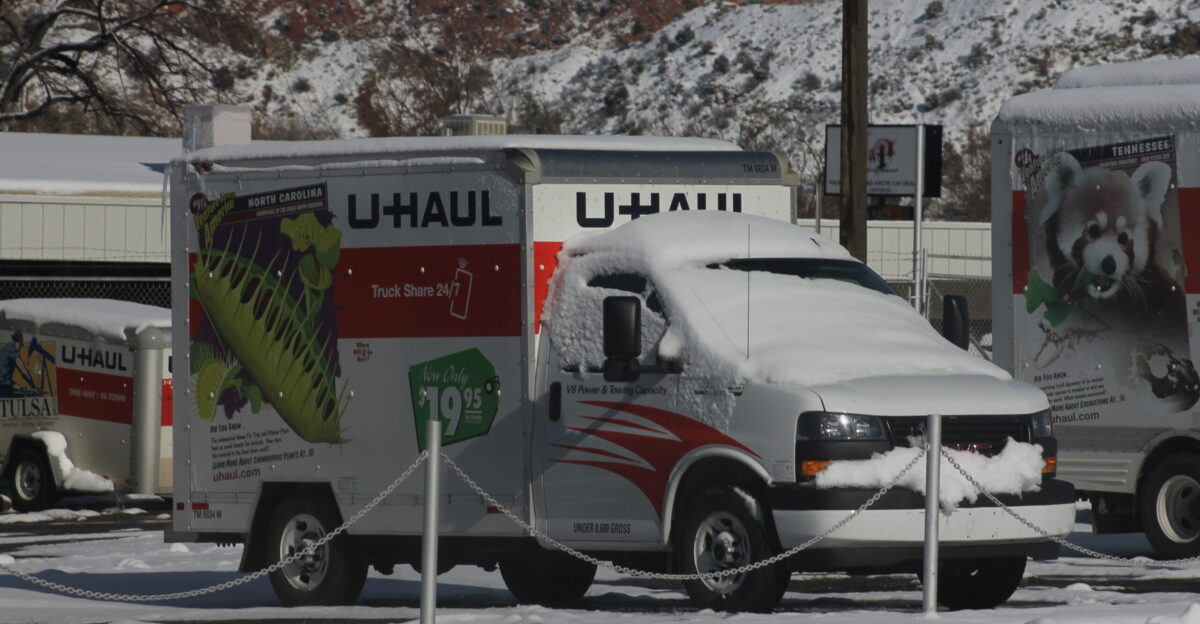 A snow covered GMC G-3500 U-Haul truck in Cedar City Utah