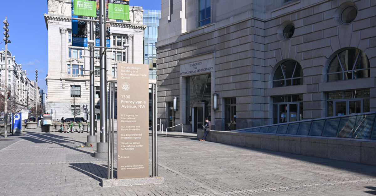 The sign for all the organizations in the Ronald Reagan Building and International Trade Center with the entrance to the US Agency for International Development commonly called USAID behind it This is on the West side of the Ronald Reagan Building 1300 Pennsylvania Avenue NW Washington DC 20004