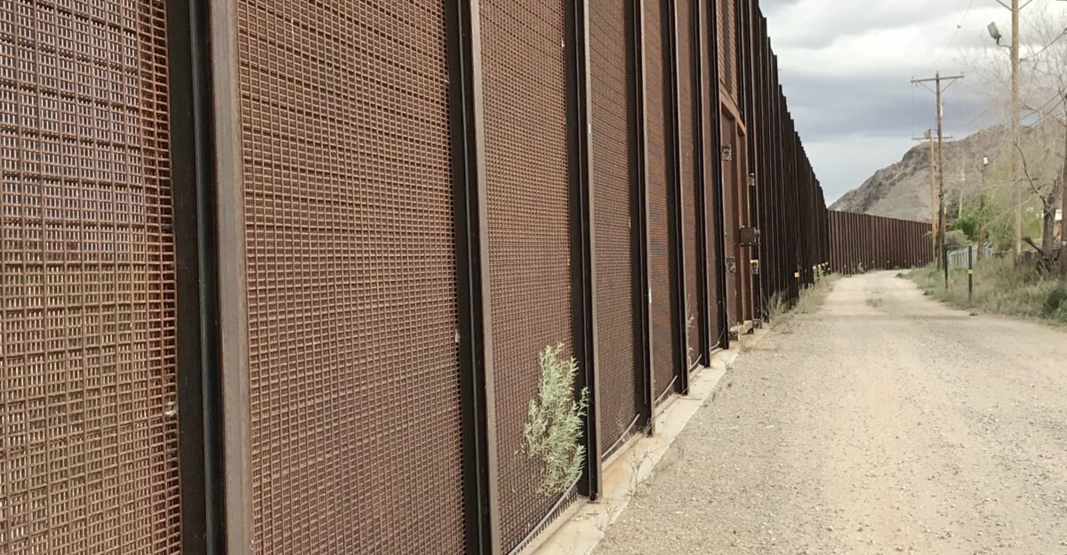 A service road at the US Border fence in El Paso TX Keywords elca el camino real de tierra adentro nht national historic trail blm el paso tx texas el paso county facilities structures and assets border fence trail natural resources clouds El Camino Real de Tierra Adentro Trail State