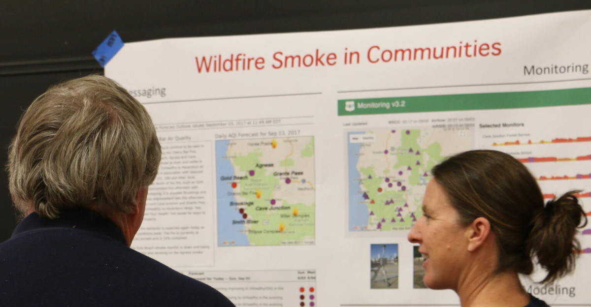 <p>On September 3, 2017, fire staff held a community meeting to provide an overview of the Chetco Bar wildfire. The meeting was held at the Illinois Valley High School in Cave Junction. It was attended by more than 550 people.
</p>
The Chetco Bar Fire was reported on July 12, 2017. The initial size-up of the fire was 1/4 acre burning in the 2002 Biscuit Fire and 1987 Silver Fire scars located in the Kalmiopsis Wilderness, roughly six air miles west of Pearsoll Peak and north of the Chetco River. The fire is approximately 5 miles northeast of Brookings, Oregon. The area is comprised of mixed conifer and deciduous forest, brush and snags from the 2002 Biscuit Fire and 1987 Silver Fire. The fire is burning in areas of fire scar and islands that were previously unburned. The combination of down, dead fuels with a newly cured grass makes the terrain quite hazardous for firefighters. Photo by Maria Thi Mai, BLM