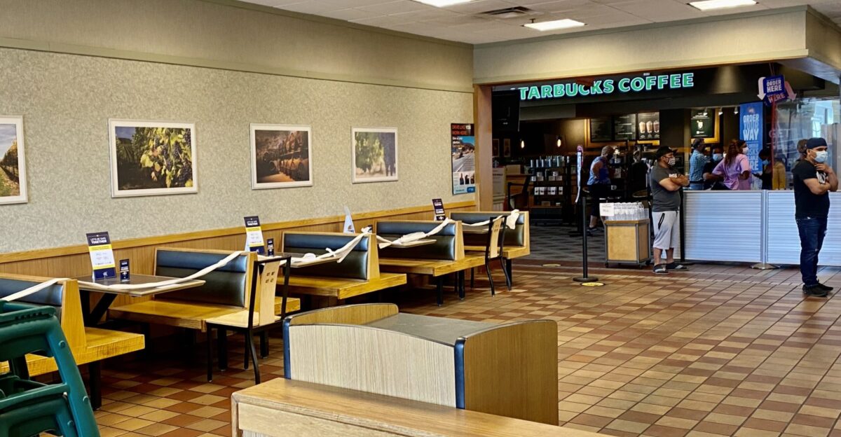 As seen at lunchtime on a May 2021 weekend though the indoor seating area has reopened at the Burger King restaurant at the New York State Thruway s Clifton Springs Travel Plaza several booths remain closed off to aid in social distancing As well many customers opt to continue wearing face masks even though they are no longer required for those vaccinated