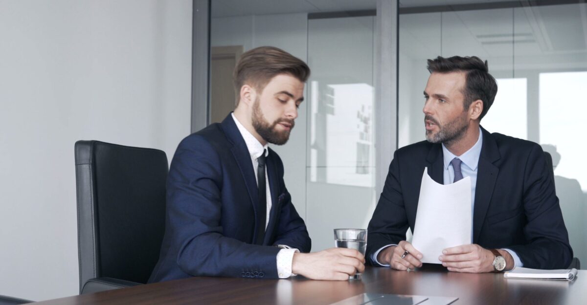 Two businessmen talking during business meeting at corporate office Stock Footage business meeting businessmen talking by MOHAMED Zenhom