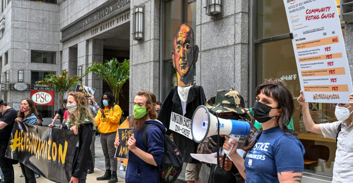 Two days before Amazon s annual general meeting on May 24 2021 activists led by Massachusetts Jobs With Justice protested in front of the offices of two major shareholders in Boston State Street Corp and Fidelity Investments to challenge Amazon s policies and practices 1 Photo by Joe Piette