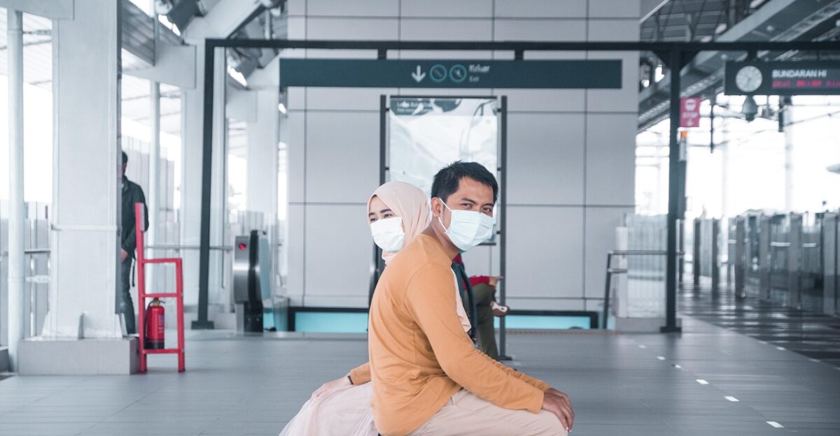 couple social distancing train station coronavirus face mask covid-19 covid distancing pandemic protection new normal indonesia jakarta covid-19 covid covid covid covid covid pandemic