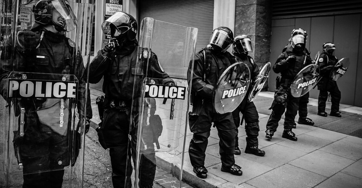 people police protest shield helmet gear black and white gray police police police police police police protest protest protest protest
