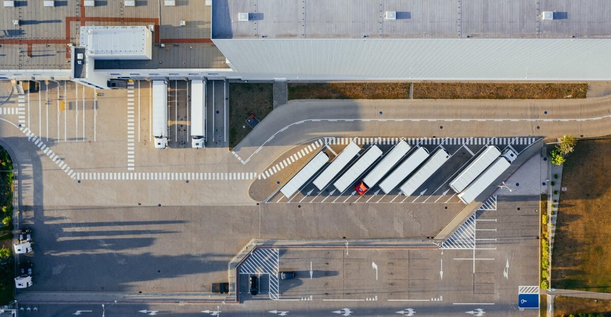 production facility logistic distribution center transit truck transport top view industrial semi aerial view heavy depot germany warehouse container truck shipping containers storehouse road loading bay factory unloading distribute unload europe aerial photography production logistic truck truck warehouse warehouse warehouse warehouse warehouse