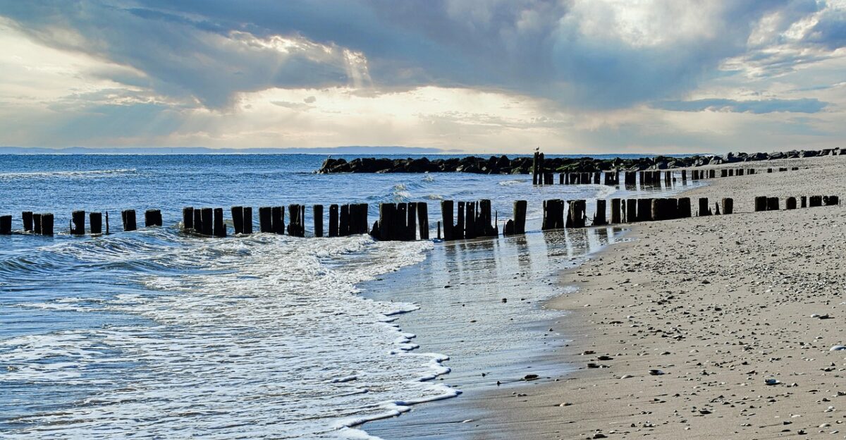 rockaway beach queens new york city beach ocean tide surf sand wooden groynes posts nature sky