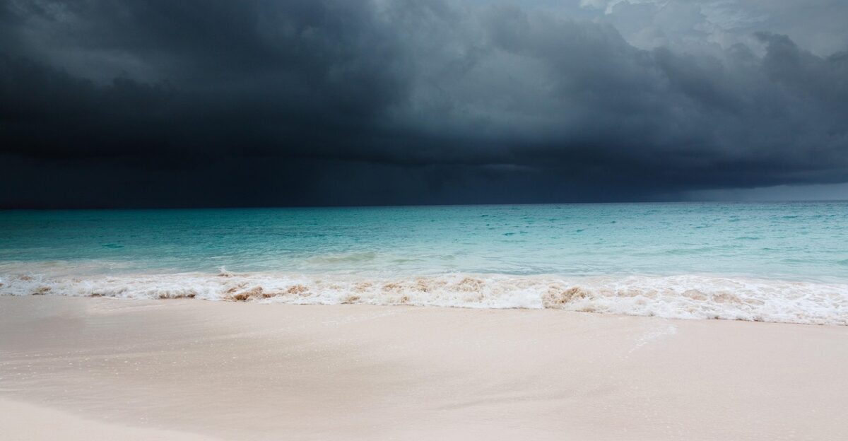 beach blue caribbean clouds cloudscape dark hurricane ocean nature sand sea shore sky tropical storm blue sky water waves weather