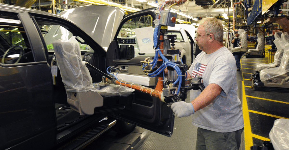A worker installs a seat into a Ford F-150 at the w Ford Kansas City Assembly Plant Claycomo Missouri USA