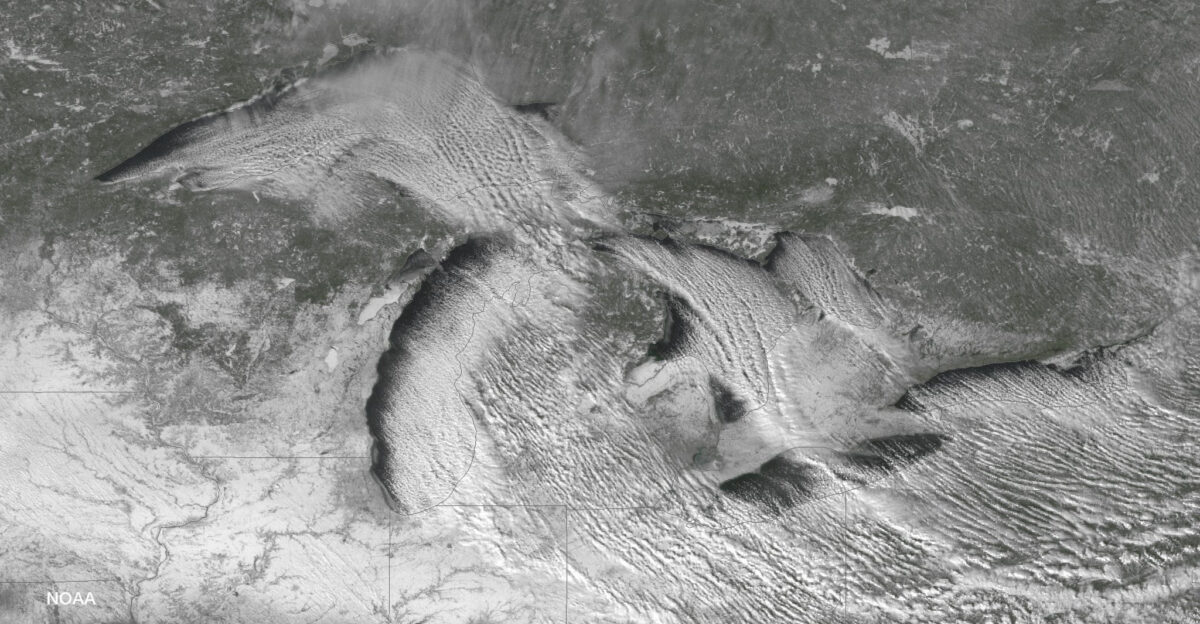 Lake effect snow bands over the Great Lakes region Cold air moving over theGreat Lakes and some upper-level energy aided in producing lake effect snowdownwind from the Great Lakes and over parts of the Northern CentralAppalachians Image taken by GOES East Image credit NOAA NESDIS Environmental Visualization Laboratory