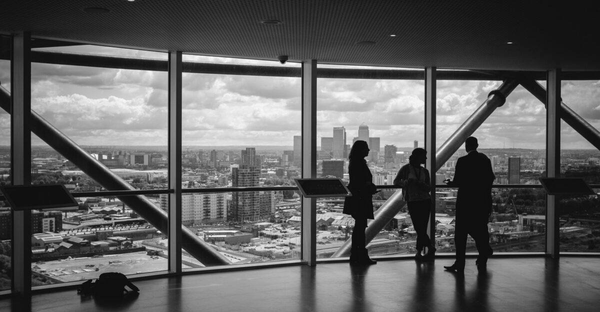 people standing inside city building