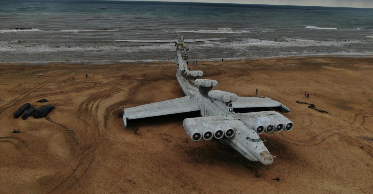 Aerial view of an abandoned Ekranoplan on the sandy shore of the Caspian Sea in Dagestan