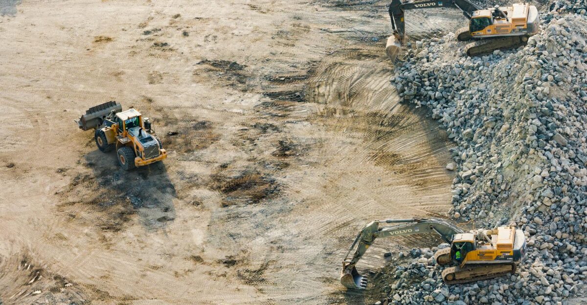 Aerial shot of heavy machinery working on a construction site in Dubai