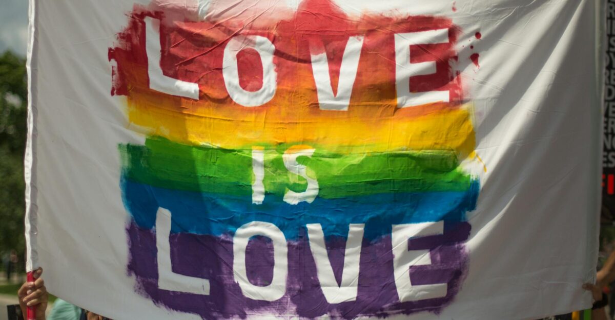 Colorful Love is Love pride banner at a parade in London Ontario celebrating equality and diversity