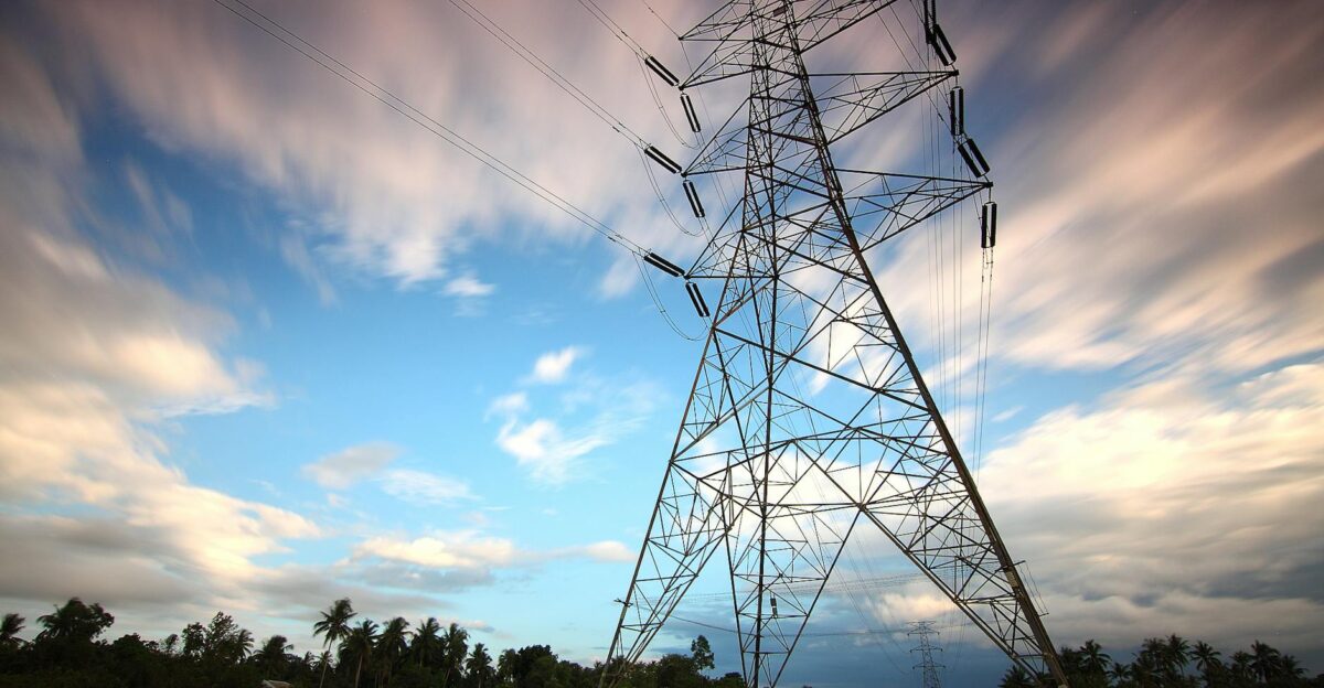 Stunning view of a towering power line against a vibrant sky showcasing energy infrastructure in nature