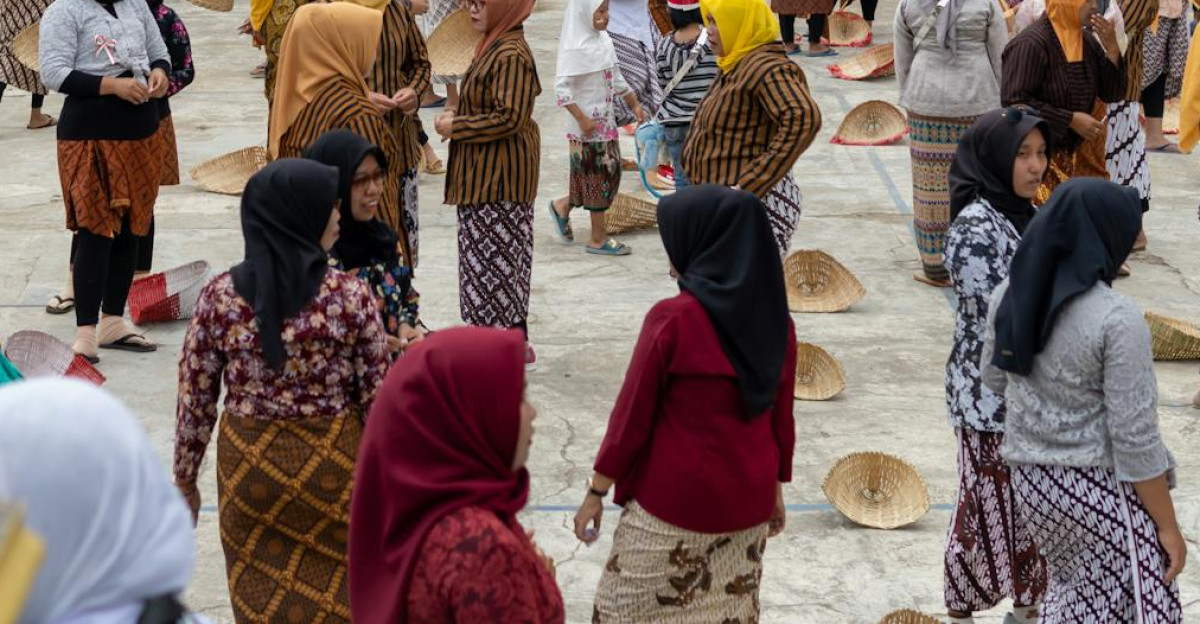 A vibrant cultural festival in Pacitan Indonesia with locals in traditional attire