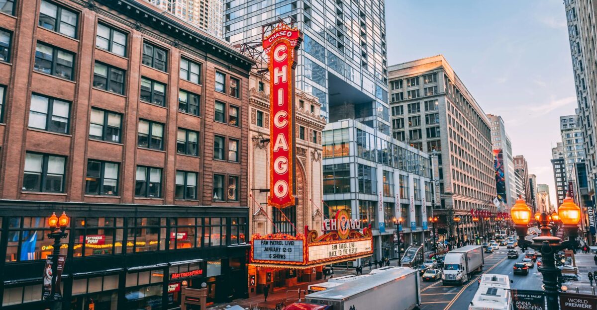 Bustling downtown Chicago street featuring iconic Chicago Theatre on a lively evening