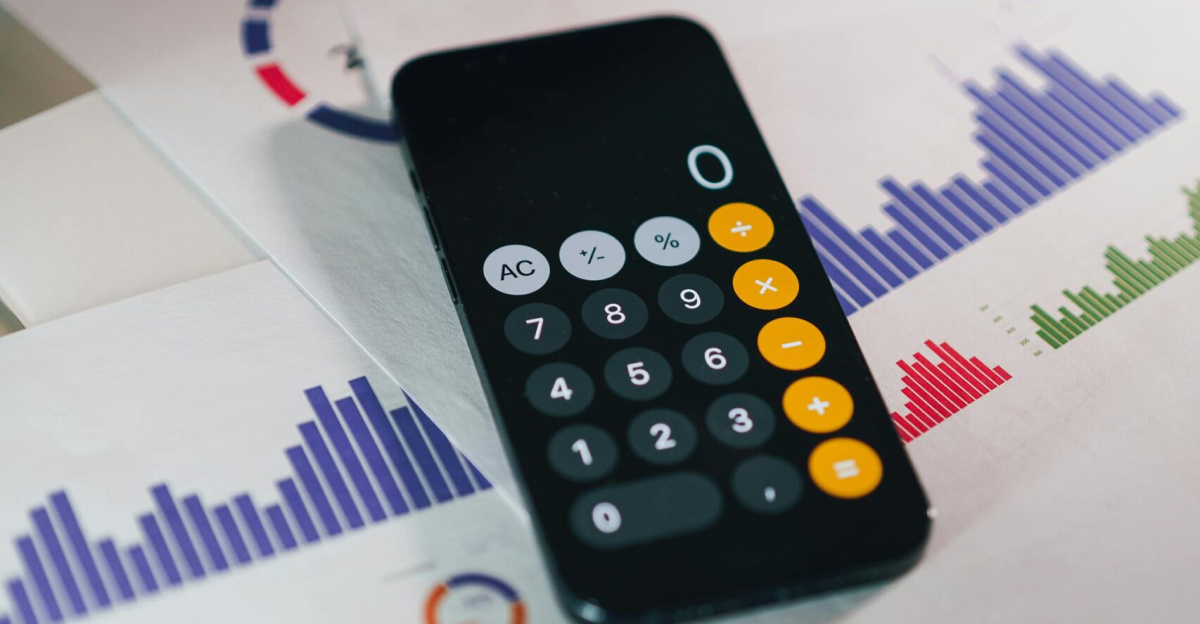 Calculator on graphs showing financial data and analytics. Ideal for business and finance themes.