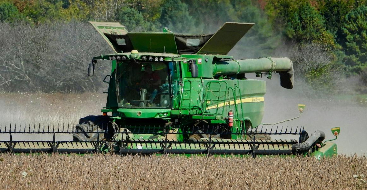 Combine harvester working in a soybean field in Ontario Canada
