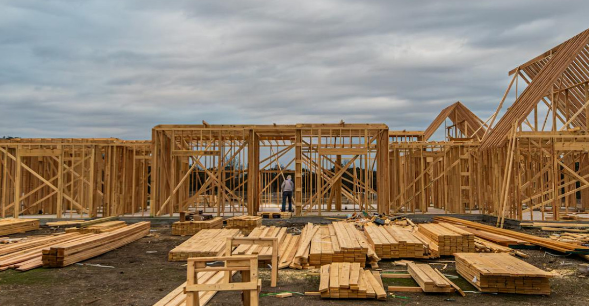 Wooden house framing under construction in Fort Worth TX during a cloudy day
