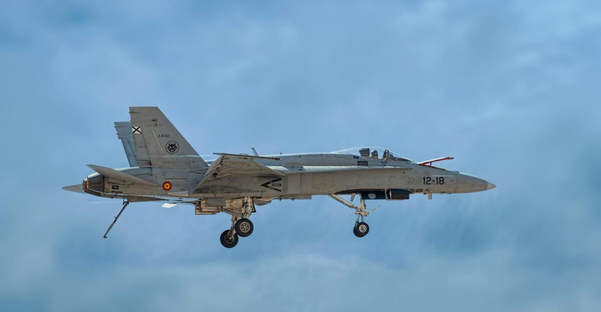 F A-18 Hornet jet flying against clear blue sky showcasing military aviation power