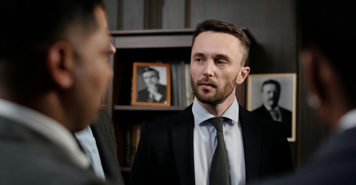 Group of men in suits having a serious business discussion in a professional setting